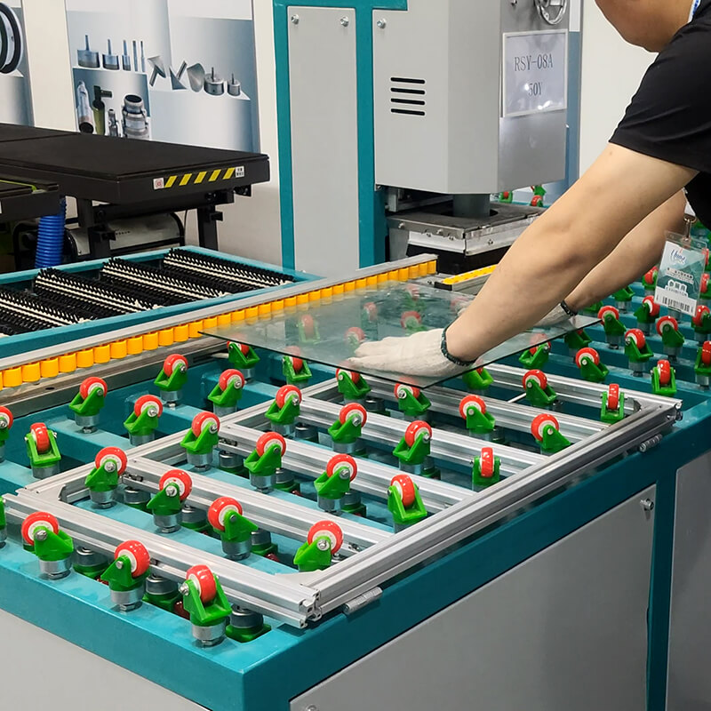 The Double Head Straight Glass Edging Machine is in operation. The Double Head Straight Glass Edging Machine is in operation.